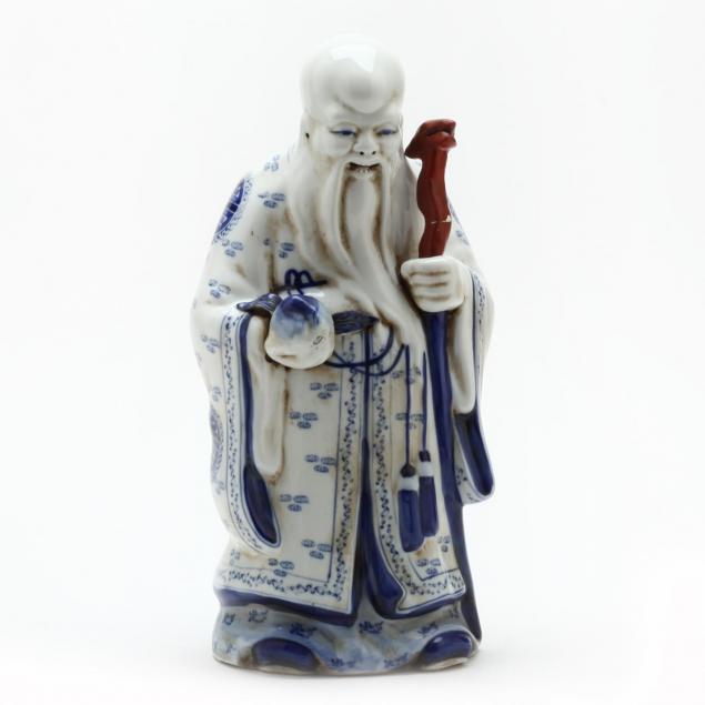 a-chinese-blue-and-white-porcelain-statue-of-the-god-of-longevity