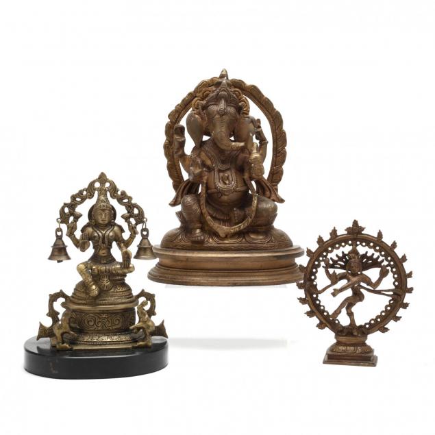 a-group-of-three-hindu-sculptures