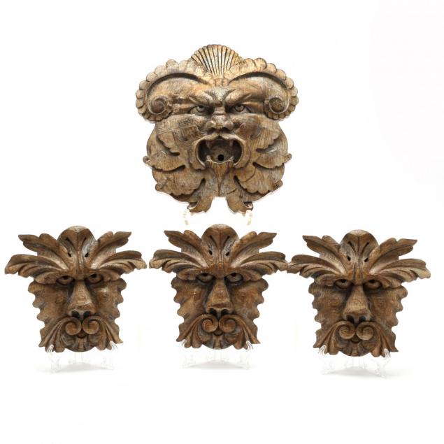 group-of-four-carved-architectural-grotesque-masks