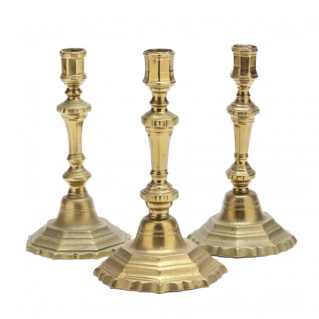 three-antique-brass-candlesticks