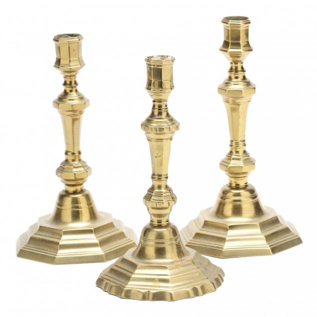 three-antique-brass-candlesticks