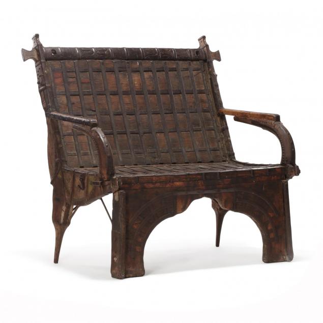 a-southeast-asian-iron-mounted-bench