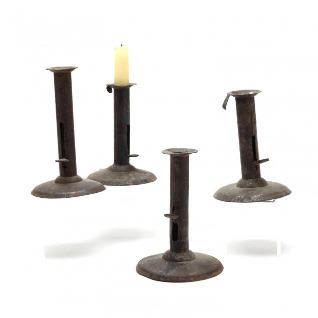 two-pairs-of-antique-push-up-candlesticks