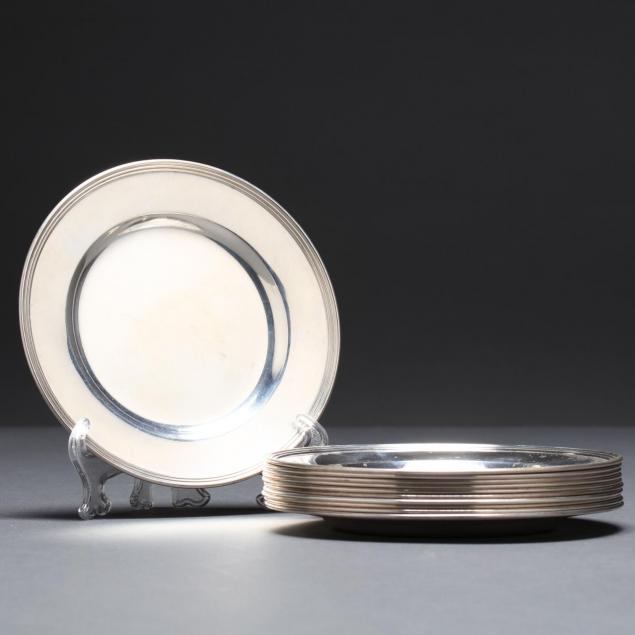 a-set-of-eleven-international-lord-saybrook-sterling-silver-bread-plates