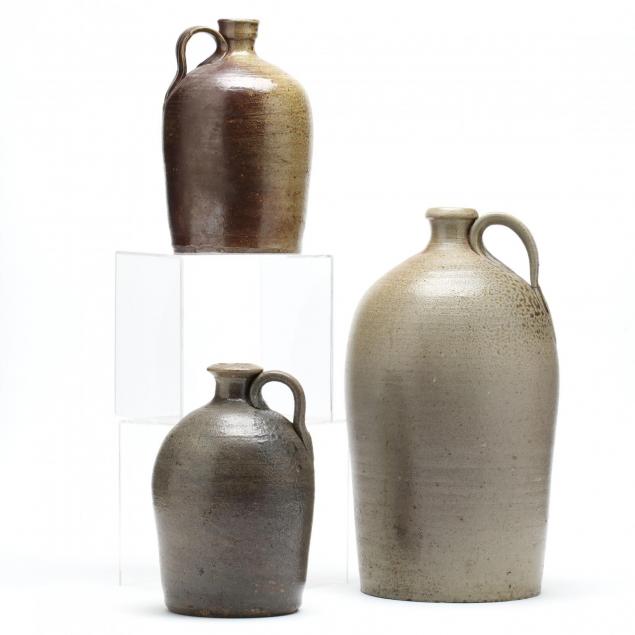 a-group-of-three-nc-pottery-salt-glazed-jugs