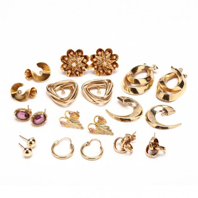 a-collection-of-gold-earrings-and-jackets