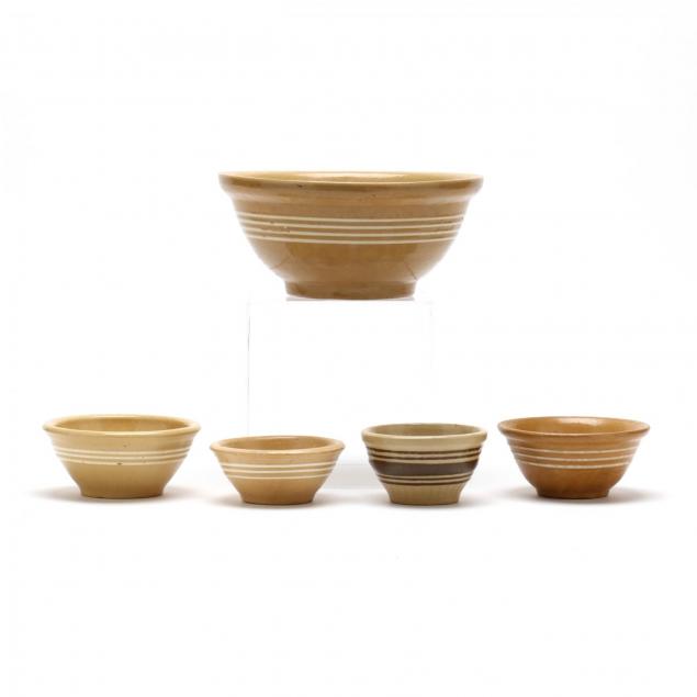 group-of-primitive-yellow-ware-mixing-bowls