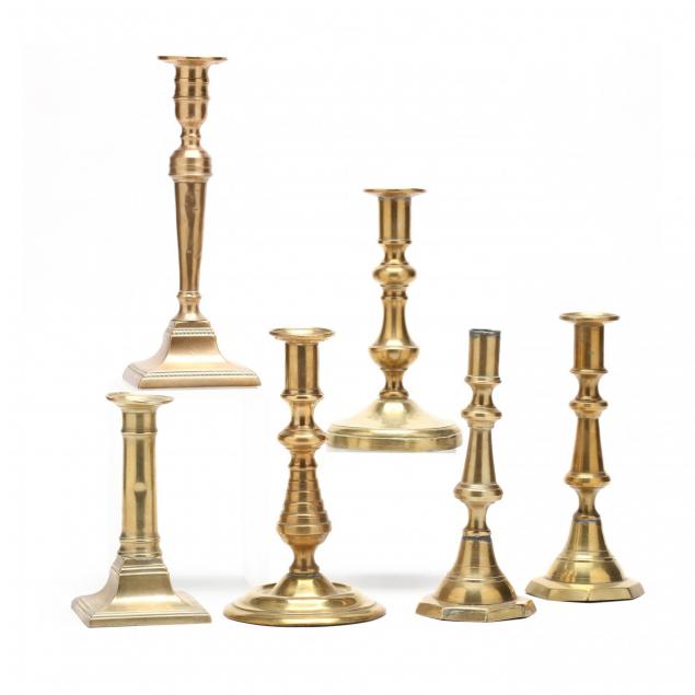 six-antique-brass-push-up-candlesticks