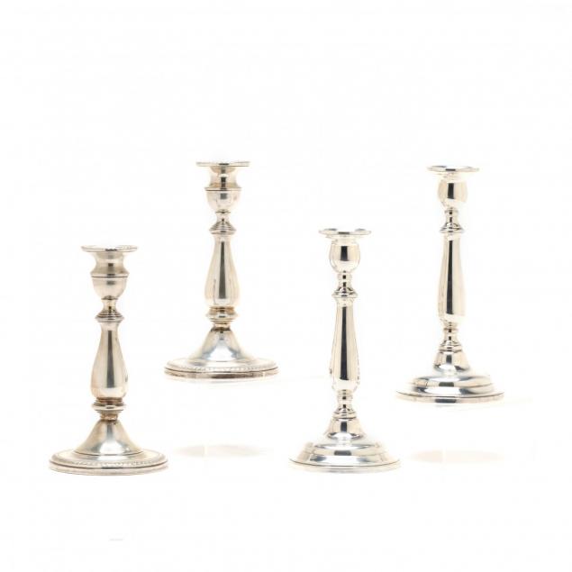 two-pairs-of-sterling-silver-candlesticks