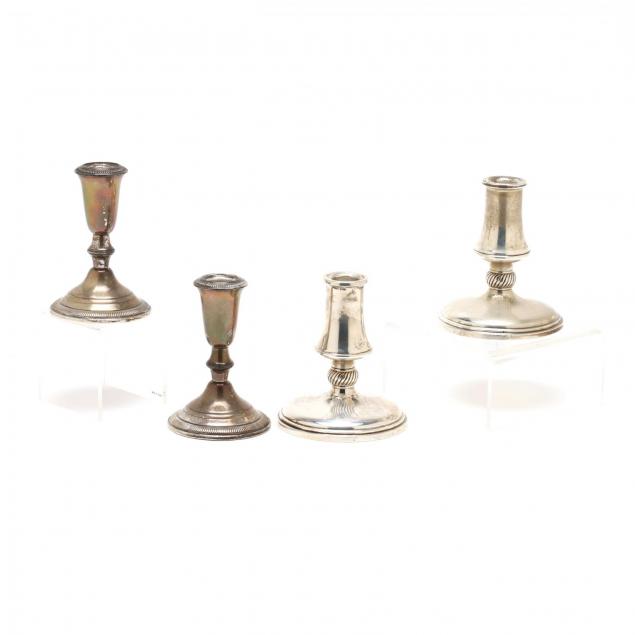 two-pairs-of-sterling-silver-candlesticks