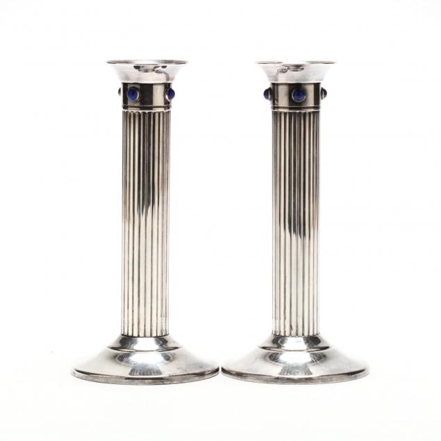 a-pair-of-cartier-silverplate-candlesticks