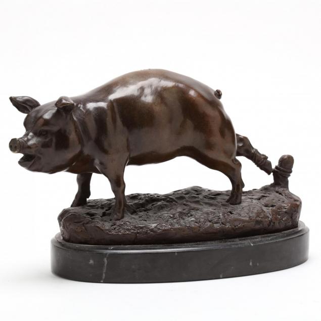 a-bronze-sculpture-of-a-tethered-pig