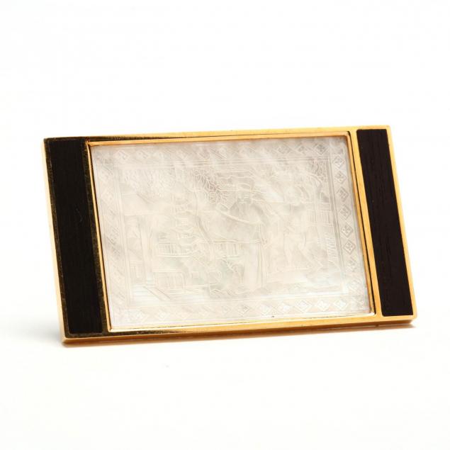 18kt-carved-mother-of-pearl-gaming-chip-and-ebony-brooch