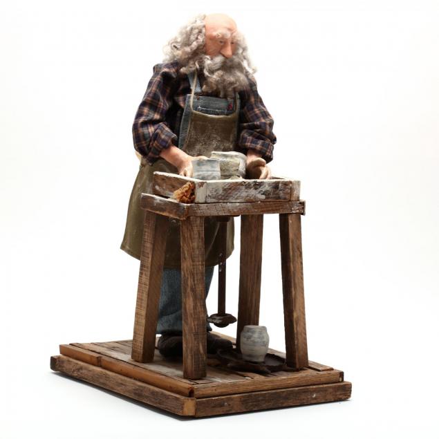 original-folk-art-composition-of-a-potter-at-his-wheel