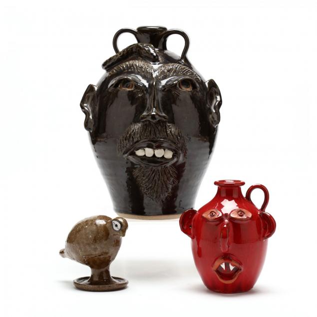 nc-folk-pottery-group-with-a-js-pottery-buggy-face-jug