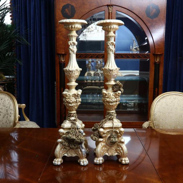a-pair-of-large-gilt-baroque-style-candlesticks