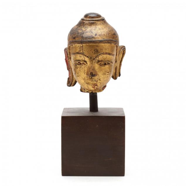 an-antique-carved-gilt-head-of-the-buddha