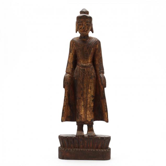 a-carved-and-gilt-standing-buddha