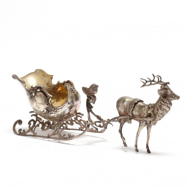a-decorative-silver-sleigh-with-reindeer