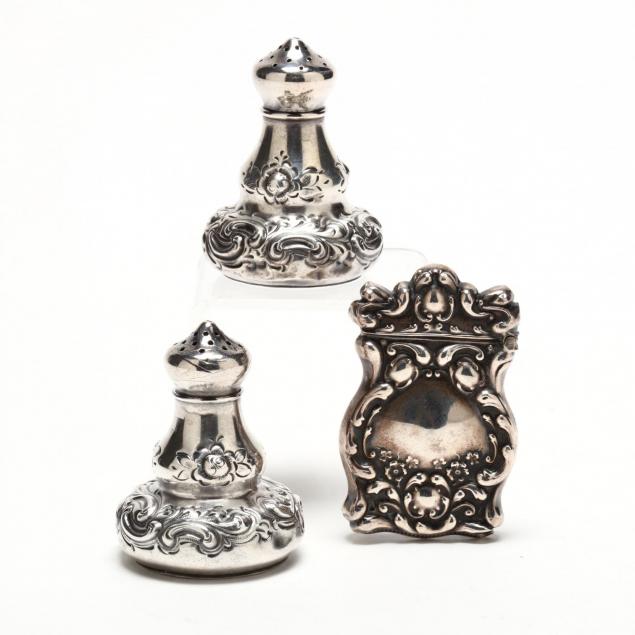 a-pair-of-sterling-silver-shakers-and-a-match-safe