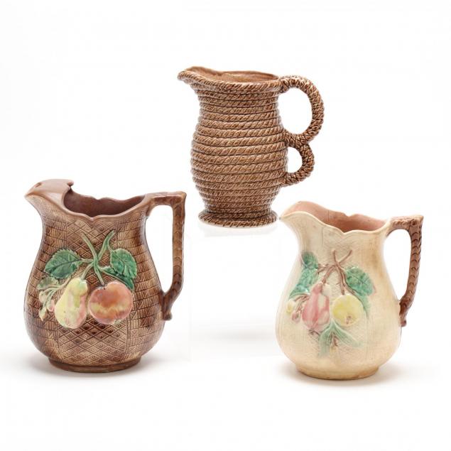 three-vintage-majolica-pitchers