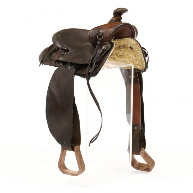 charles-e-collins-am-1879-1962-leather-saddle