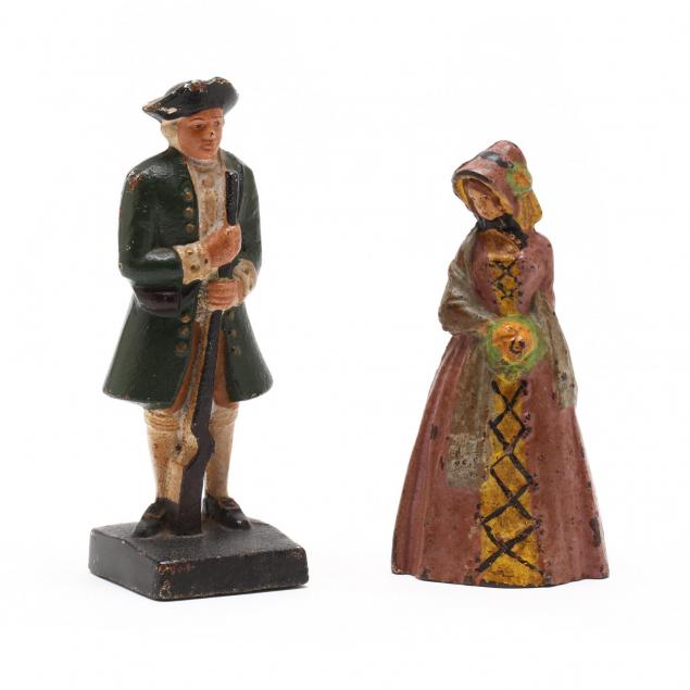 two-cast-iron-colonial-figure-doorstops