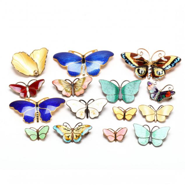 a-group-of-enamel-and-sterling-butterfly-brooches