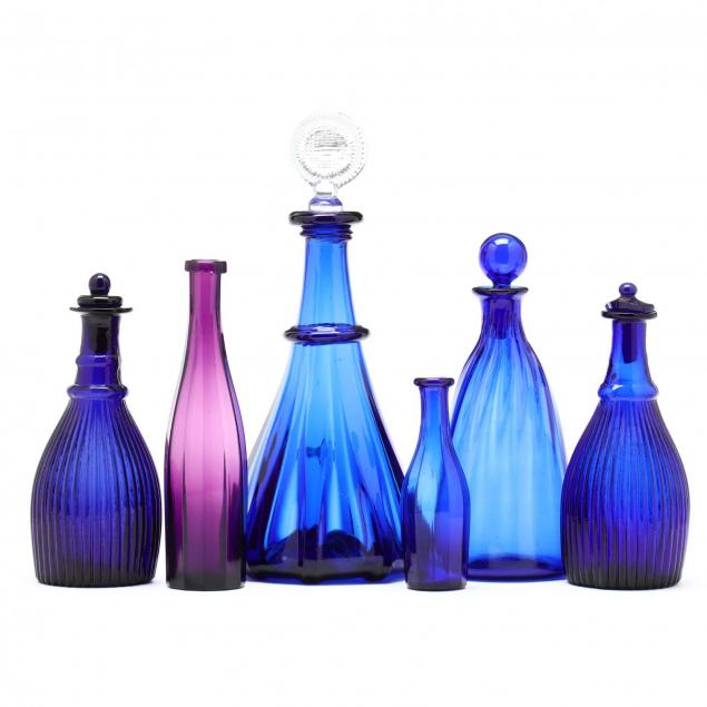 six-antique-colored-glass-decanters