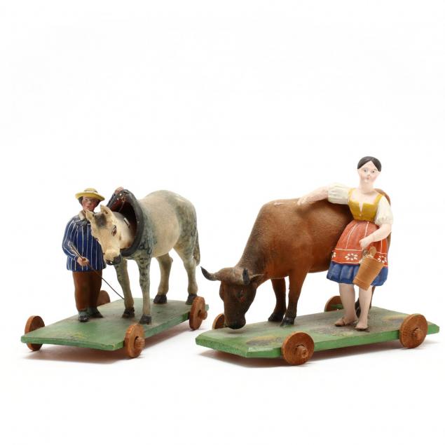 two-vintage-cow-pull-toys