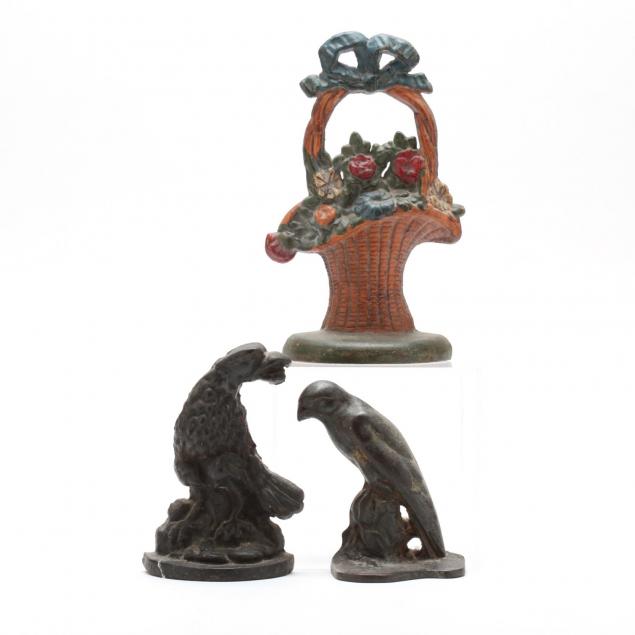 group-of-three-vintage-cast-iron-doorstops