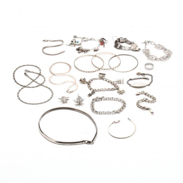 a-group-of-silver-jewelry