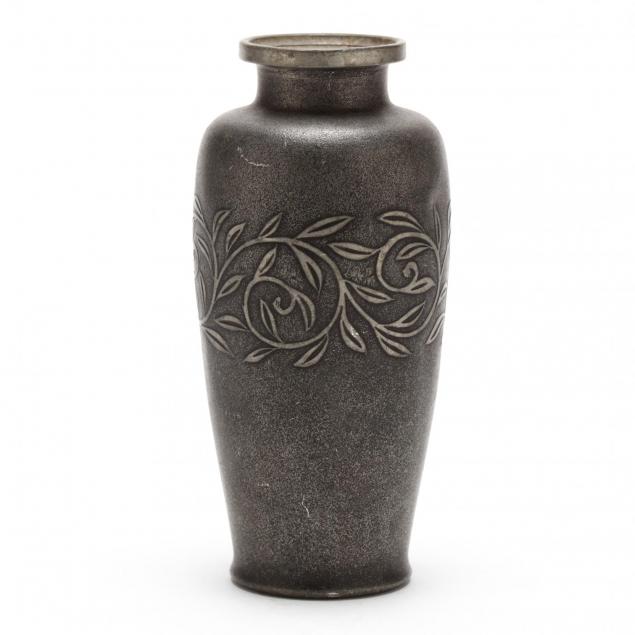 an-asian-pewter-vase-with-vine-decoration