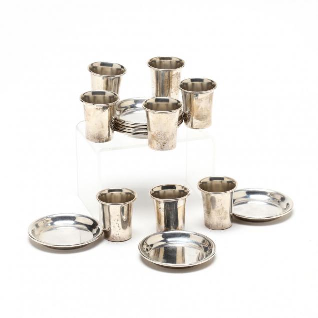 a-set-of-eight-sterling-silver-cigarette-stands