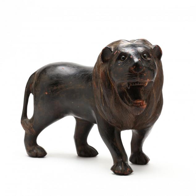 carved-figure-of-a-standing-lion