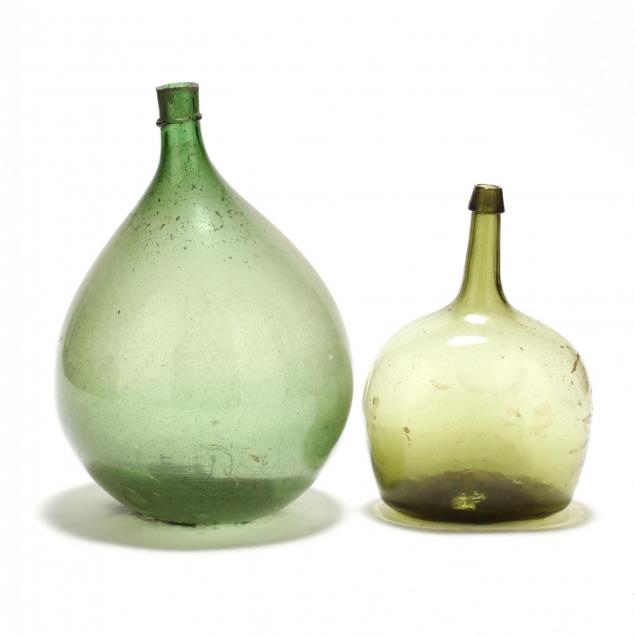 two-green-glass-demijohns
