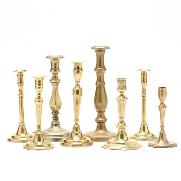 eight-early-brass-candlesticks