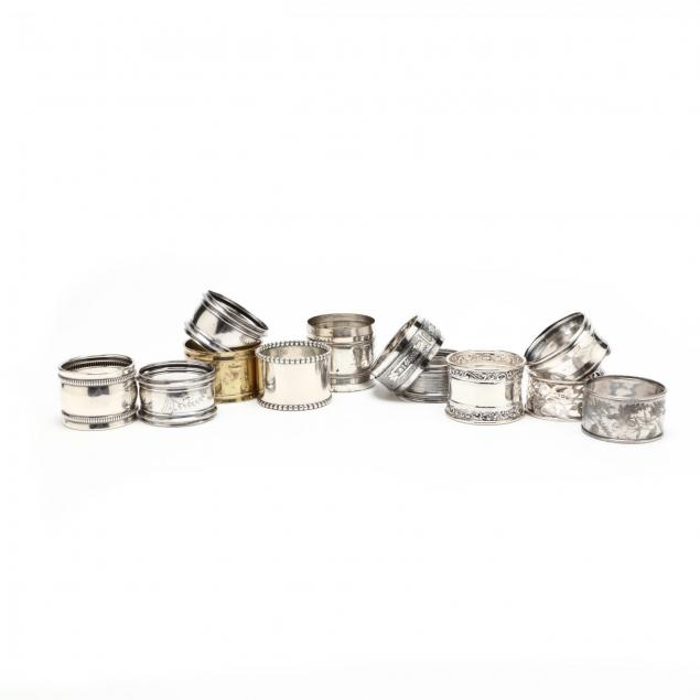 an-assembled-set-of-twelve-sterling-silver-silverplate-napkin-rings