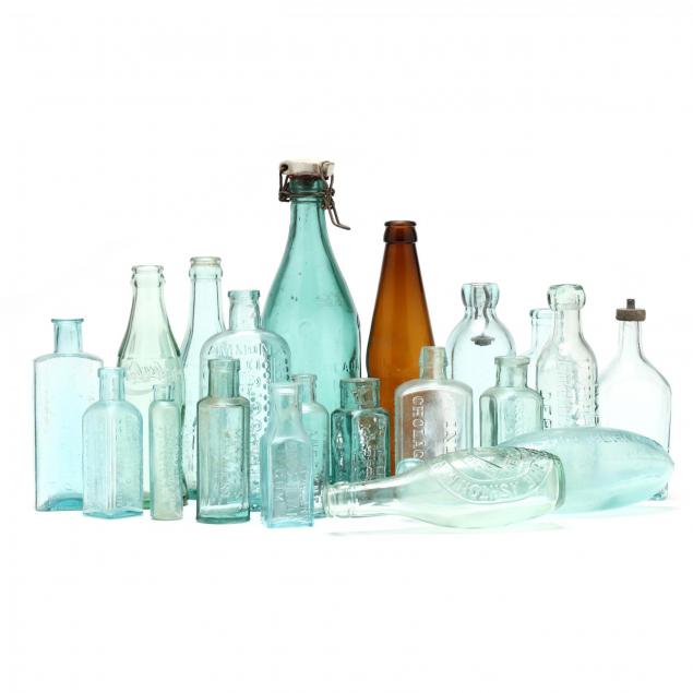 group-of-antique-advertising-glass-bottles