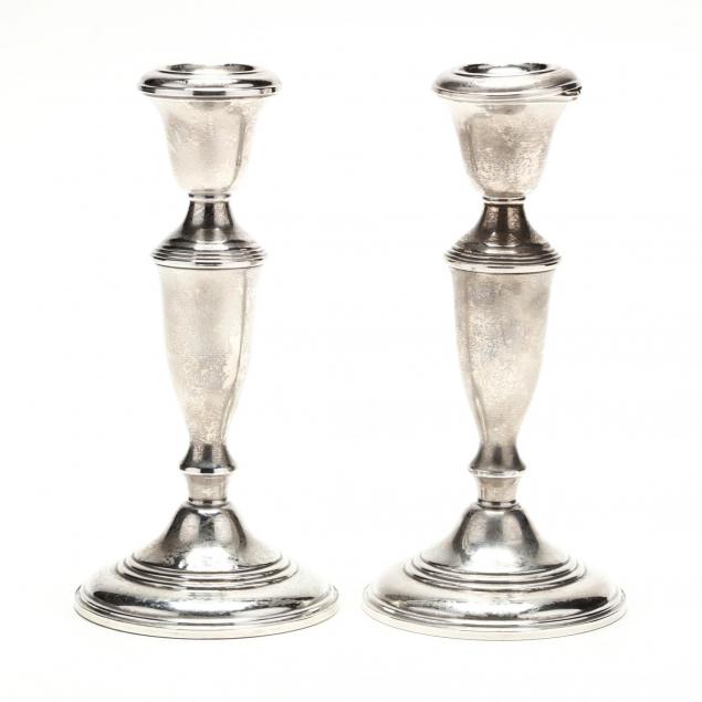 a-pair-of-sterling-silver-candlesticks