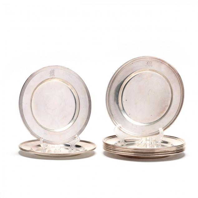 an-assembled-set-of-nine-sterling-silver-bread-plates