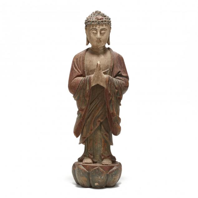 a-standing-carved-wooden-statue-of-a-buddha