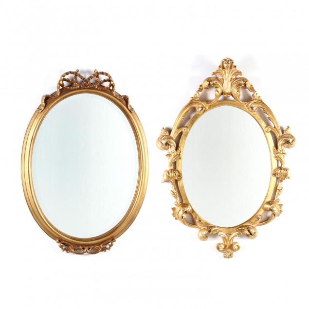 two-decorative-gilt-oval-framed-mirrors