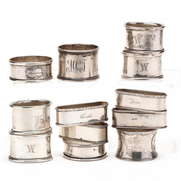 an-assembled-set-of-twelve-sterling-silver-napkin-rings