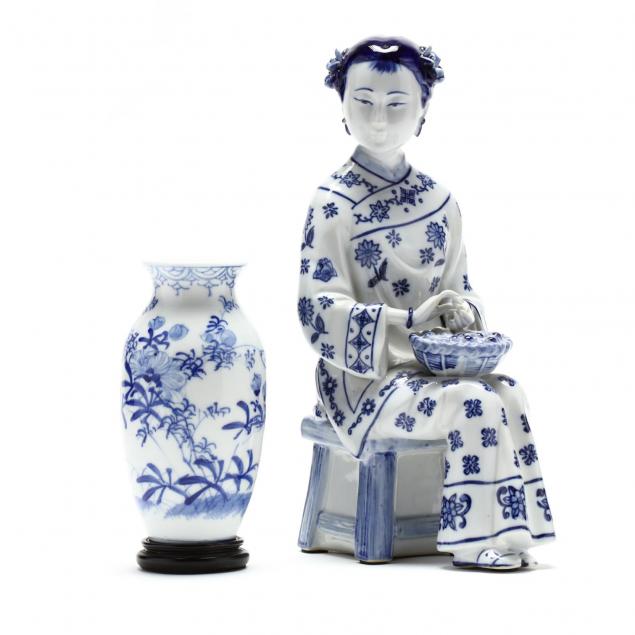 a-chinese-blue-and-white-porcelain-seated-figure-and-vase