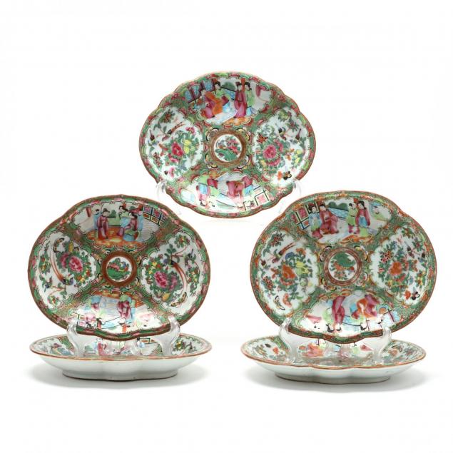 a-group-of-five-oval-serving-plates