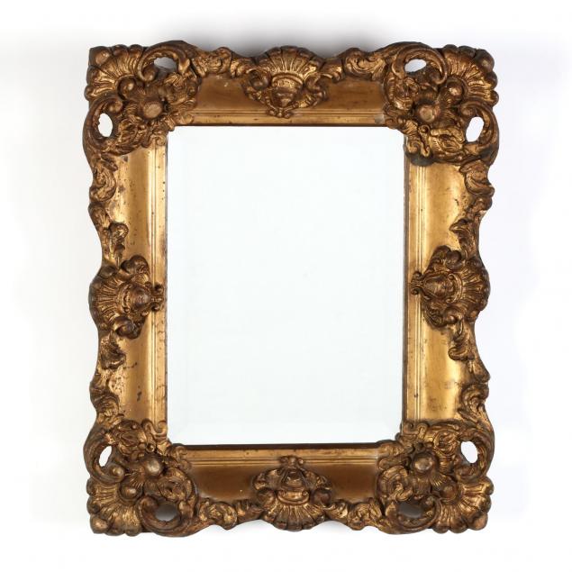 an-antique-gilt-frame-with-beveled-mirror