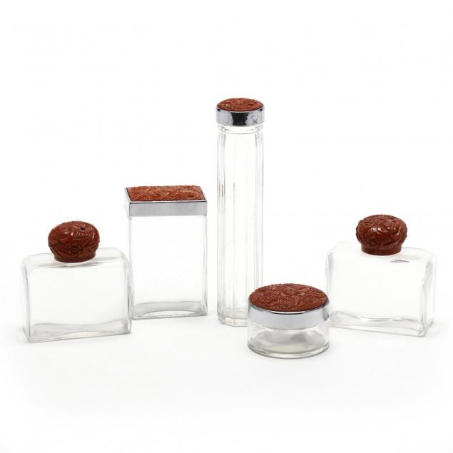 a-five-piece-bakelite-and-glass-vanity-set