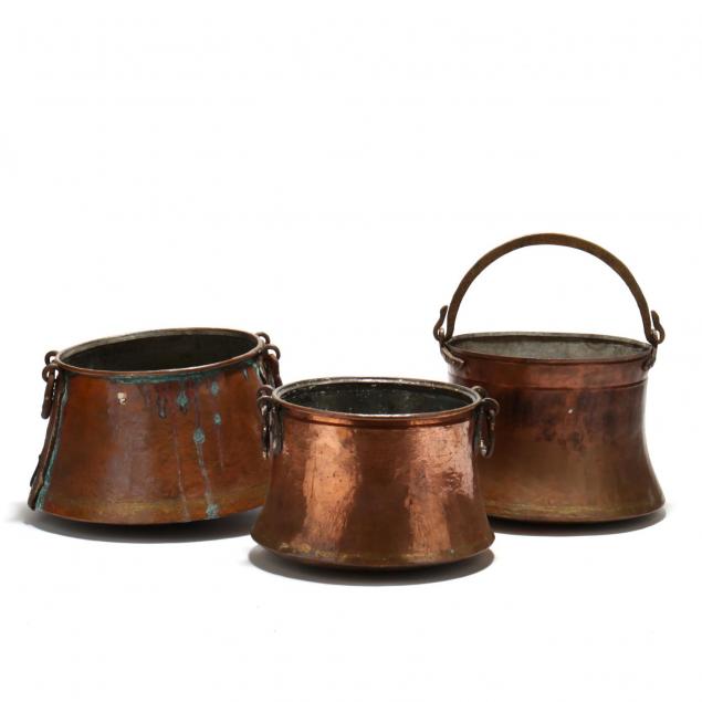 three-antique-large-copper-cauldrons