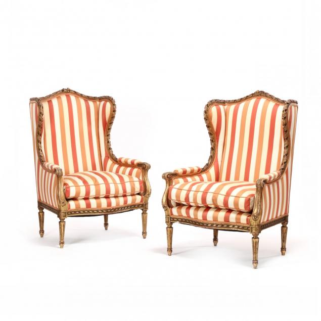 pair-of-italianate-carved-and-gilt-upholstered-wing-chairs